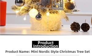 Mini Nordic Christmas tree with silver baubles, reindeer charms, and fluffy white base