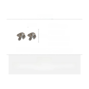 Detail view of silver mushroom earrings with irregular pleated metal texture and dimensions