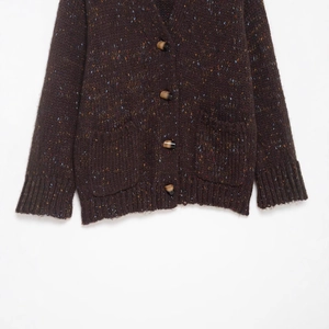 Women's dark brown chunky knit cardigan with colorful flecks, V-neck, and marble buttons