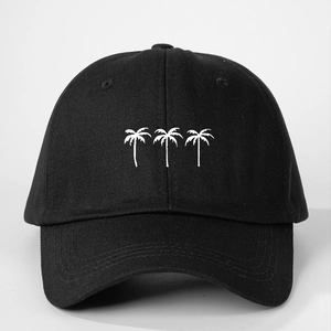 Close-up of black cotton baseball cap featuring three white palm tree embroidery details