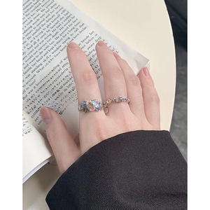 Vintage style S925 silver ring set with colorful zircon and opal stones worn by a model