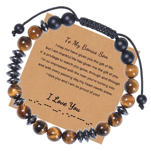 Detail of tiger eye bead bracelet with Morse code card for son in gift packaging