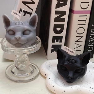 Gothic black and grey three-eyed cat scented candles for Halloween home decor