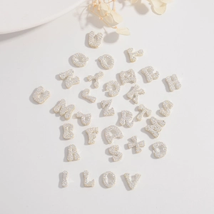 Detailed view of S925 silver micro-paved zircon letters A-Z for DIY jewelry design