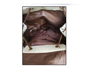 Detail view of the drawstring backpack's interior with durable lining and small inner pocket