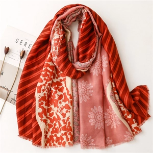 Bohemian style soft floral scarf with geometric patterns and red accents on white background