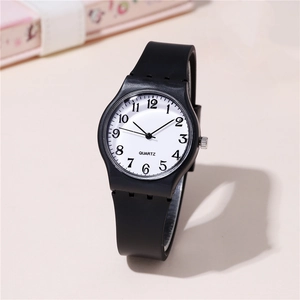 Minimalist quartz watch with white dial, black numbers and pink silicone strap