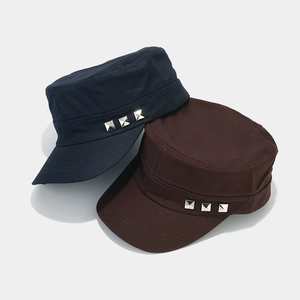 Flat top cadet army caps in navy and brown colors with decorative metal pyramid rivets