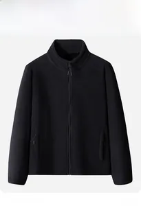 Detail of a black fleece jacket showing the high collar zipper and warm thermal fabric