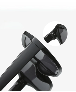Detail shot of durable metal hinges on oversized polygonal black sunglasses frames