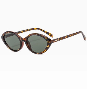 Macro detail of tortoiseshell cat eye sunglasses frame with silver metal rivets