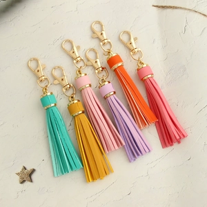 Set of 6 colorful leather tassel keychains with gold swivel hooks and metal caps