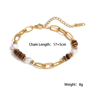 Detail showing 18K gold beaded stainless steel bracelet with pearls and tiger eye stones
