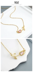 Detail of tulip pendant with pink water-drop gemstone and zircon on gold titanium necklace