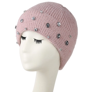 Detail of pink knitted beanie featuring sparkling crystal beads and wide ribbed cuff
