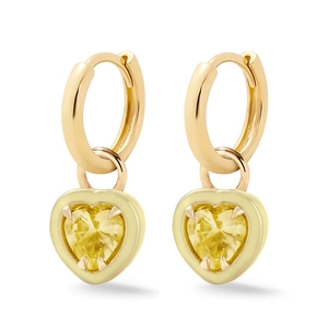 Detailed close-up of golden hoop earrings featuring vibrant yellow heart pendants