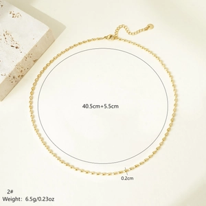 Detail of golden oval bead necklace featuring adjustable lobster clasp and chain metrics