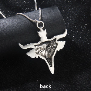 Back view of silver bull head necklace pendant on black cylindrical jewelry display stand
