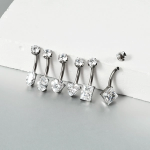 Detailed macro view of 6 different geometric zircon cuts on G23 titanium belly rings