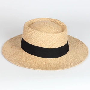 Close-up of a classic flat top straw boater hat with a wide black grosgrain ribbon band