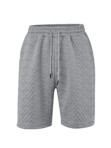 Detailed view of gray drawstring waistband and jacquard fabric on men's casual shorts