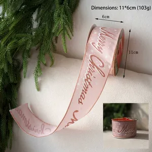 Pink velvet ribbon with rose gold Merry Christmas lettering and white snowflakes