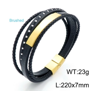 Detail of multi-layer black braided leather bracelet with golden brushed steel plate