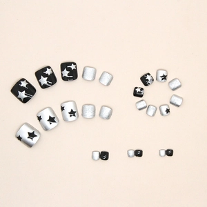 Sparkly star press-on toe nails with black and silver glitter designs for women