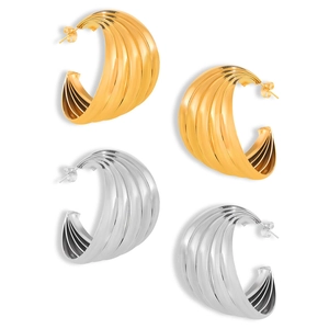 Modern gold and silver layered multi-line geometric C-shaped hoop earrings on white background
