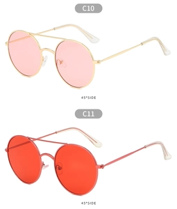 Detail of retro round metal sunglasses in pink and red lenses at 45 degree angle