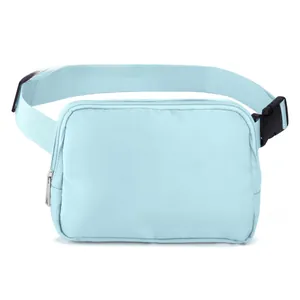 Close-up of durable light blue nylon waist bag with black adjustable strap and buckle