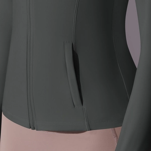 Close-up of the zipper pocket and high-elastic nylon fabric on women sport jacket