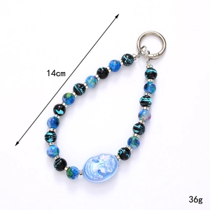 Blue and turquoise beaded phone strap with relief portrait pendant and 14cm length