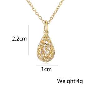 Detail view of gold teardrop pendant with zircon inlay showing dimensions 2.2cm x 1cm