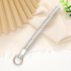 Detailed texture of blue and beige woven wrist strap with a silver metal clasp