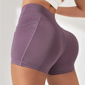 Purple yoga shorts with side pocket and mesh detail, slim fit for fitness and running