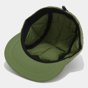 Detail view of olive quilted baseball cap featuring adjustable bungee cord and sweatband