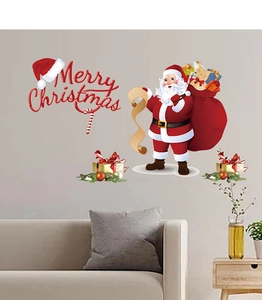Detailed view of Santa Claus and gift bag wall decals on a cream living room wall