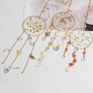 Detailed trio of golden suncatchers with crystal prisms and bohemian celestial charms
