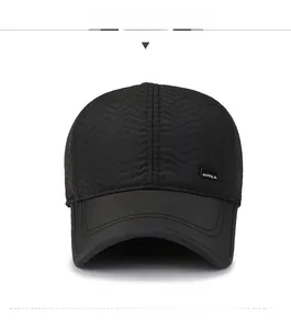 Front view of black quilted baseball cap with wavy stitching and sporting emblem
