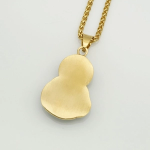 Detailed view of Saint Jude gold plated gourd pendant on a twisted rope chain necklace