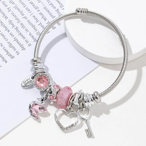 Silver steel wire bracelet with pink crystal beads, heart pendant and swan charm