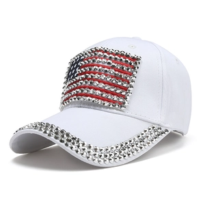 White baseball cap with rhinestone American flag design and sparkling brim edge