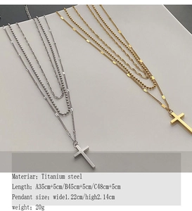 Detailed specs of layered titanium steel cross necklaces in silver and gold finishes