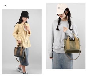 Detail of grey and olive canvas tote bags with leather handles and adjustable straps