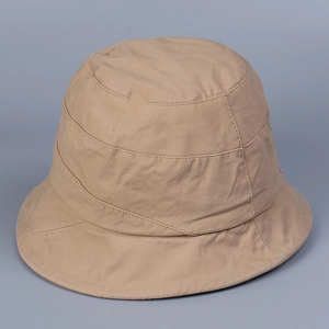 Detail view of khaki cotton bucket hat with parallel stitching on a round crown