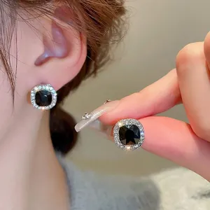 Minimalist square black diamond stud earrings with silver pavé halo for women