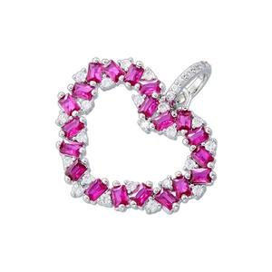 Macro detail of silver heart pendant with pink rectangular gem and small crystals
