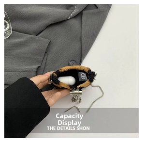 Detailed interior view of leopard print mini bag showing storage for earbuds and lipstick