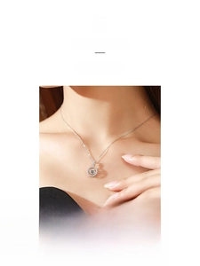 Macro detail of 925 sterling silver necklace with sparkling dancing zircon stone